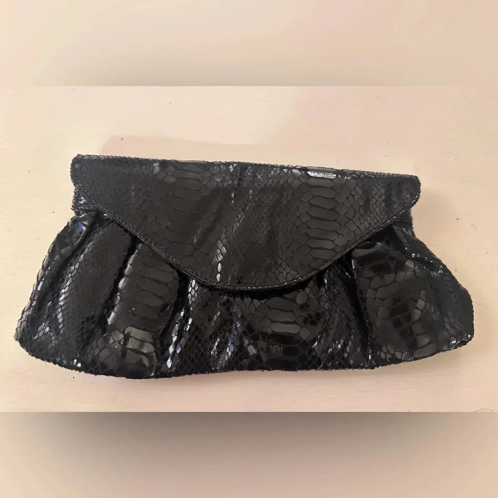 Never used black leather snakeskin clutch